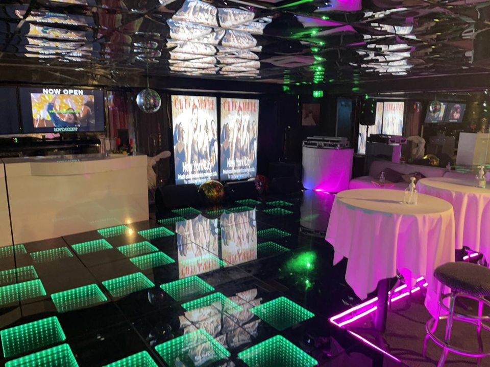 Club interior with green LED dance floor