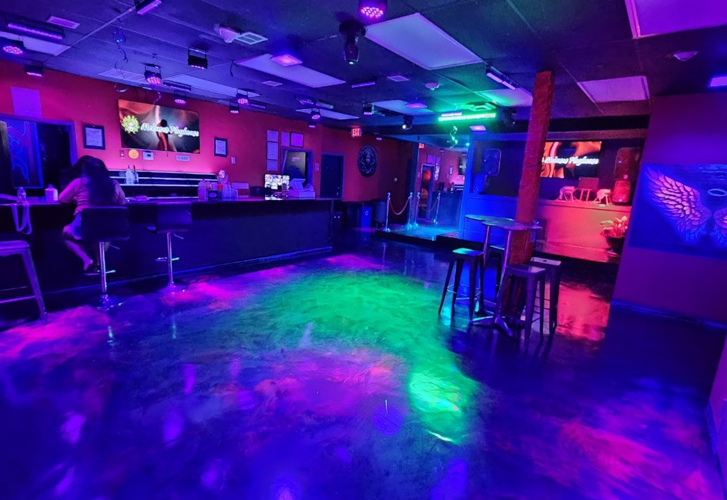 Bar and colorful dance floor inside Medusas Playhouse
