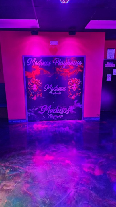 Medusas Playhouse branded wall artwork