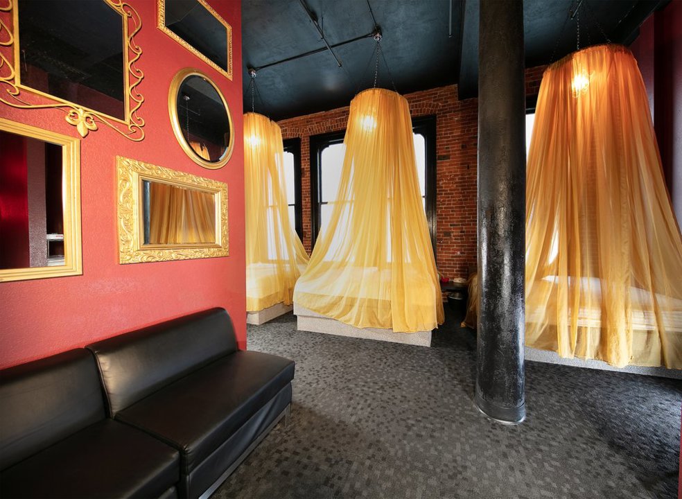 Couples lounge with canopy beds