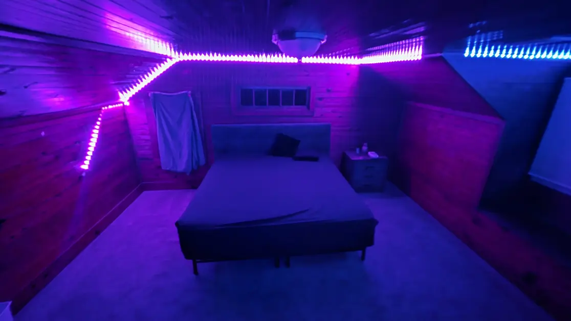 Odyssey Lounge blue and purple LED-lit playroom with bed in Garner, North Carolina