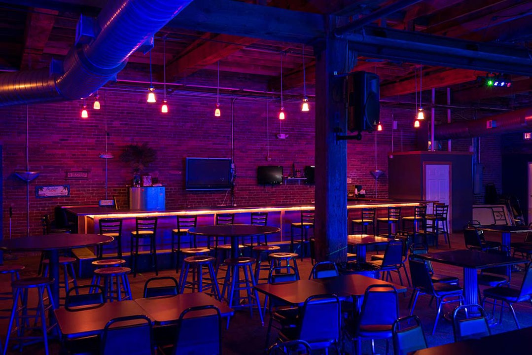 Bar and social lounge with exposed brick walls