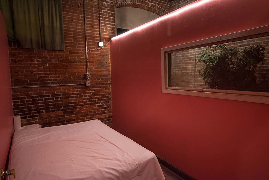 Private room with padded platform and large viewing window