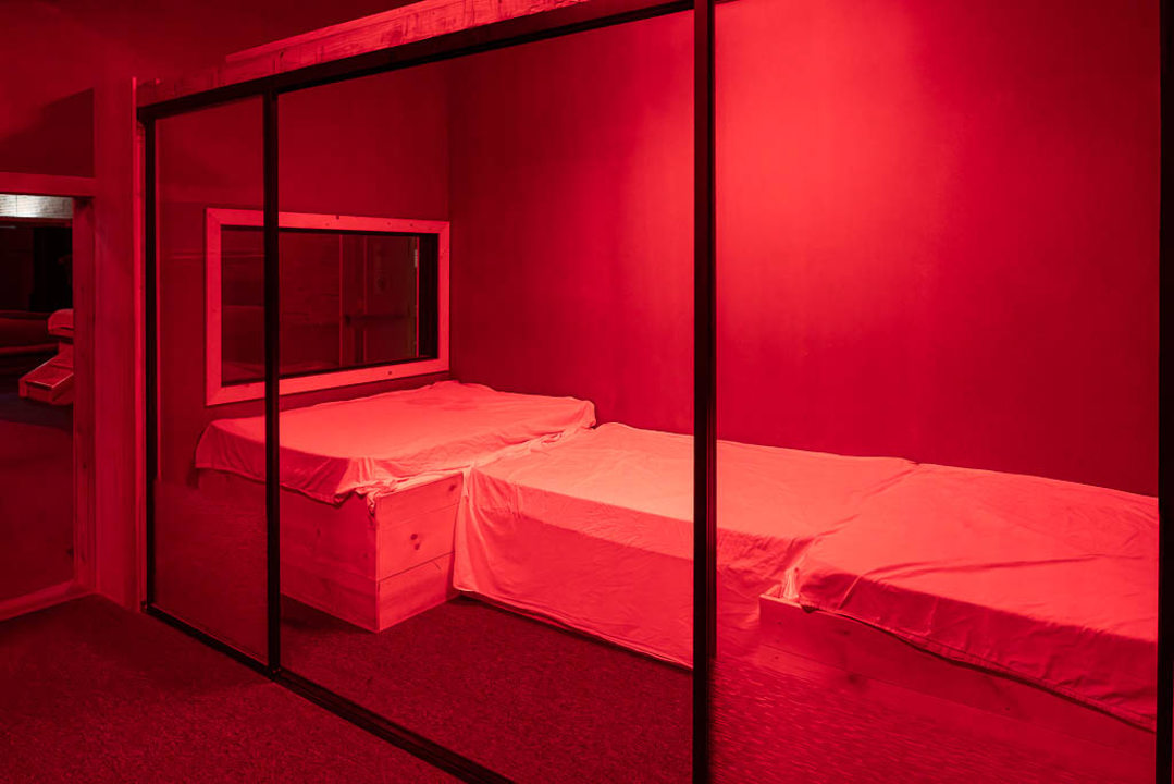 Private room with padded platforms and glass panels
