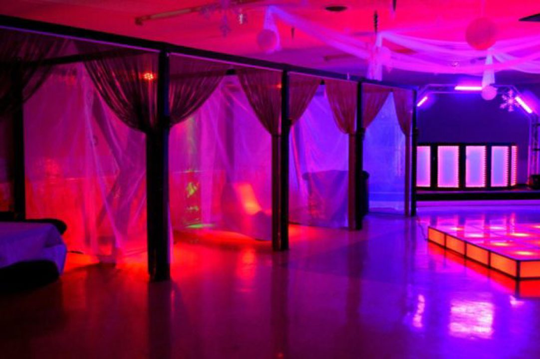 Lifestyle event space with pink and purple lighting