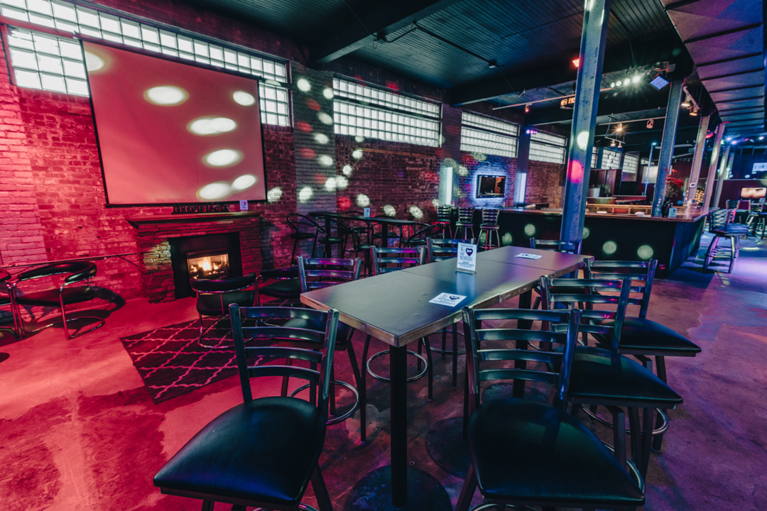 Nightclub interior with fireplace and seating