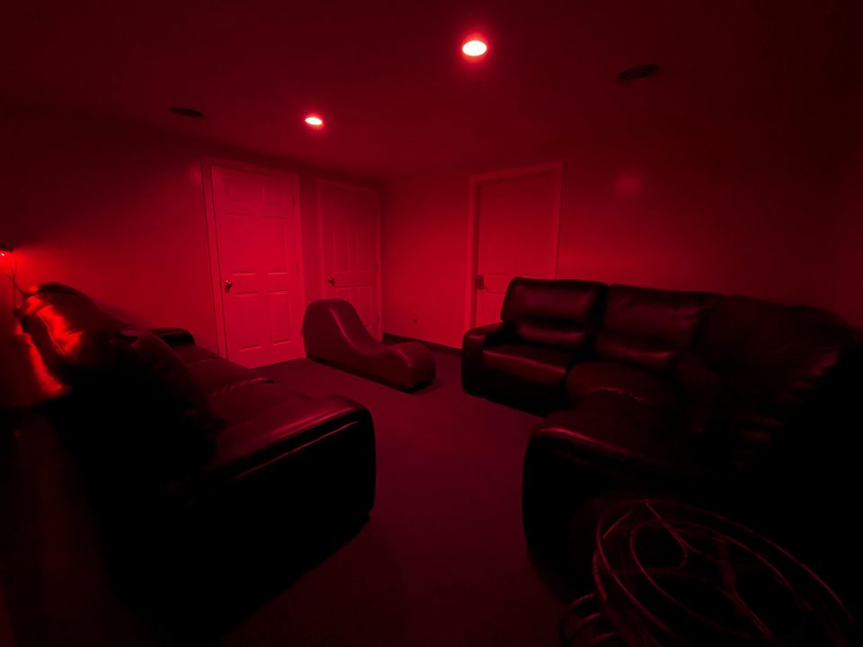 Red-lit private play room
