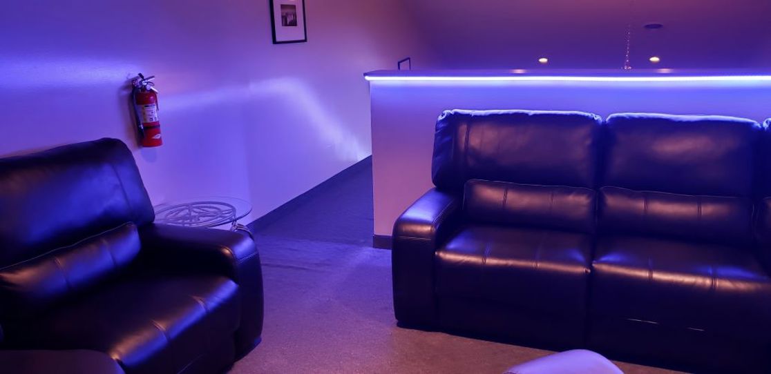Blue-lit lounge seating area