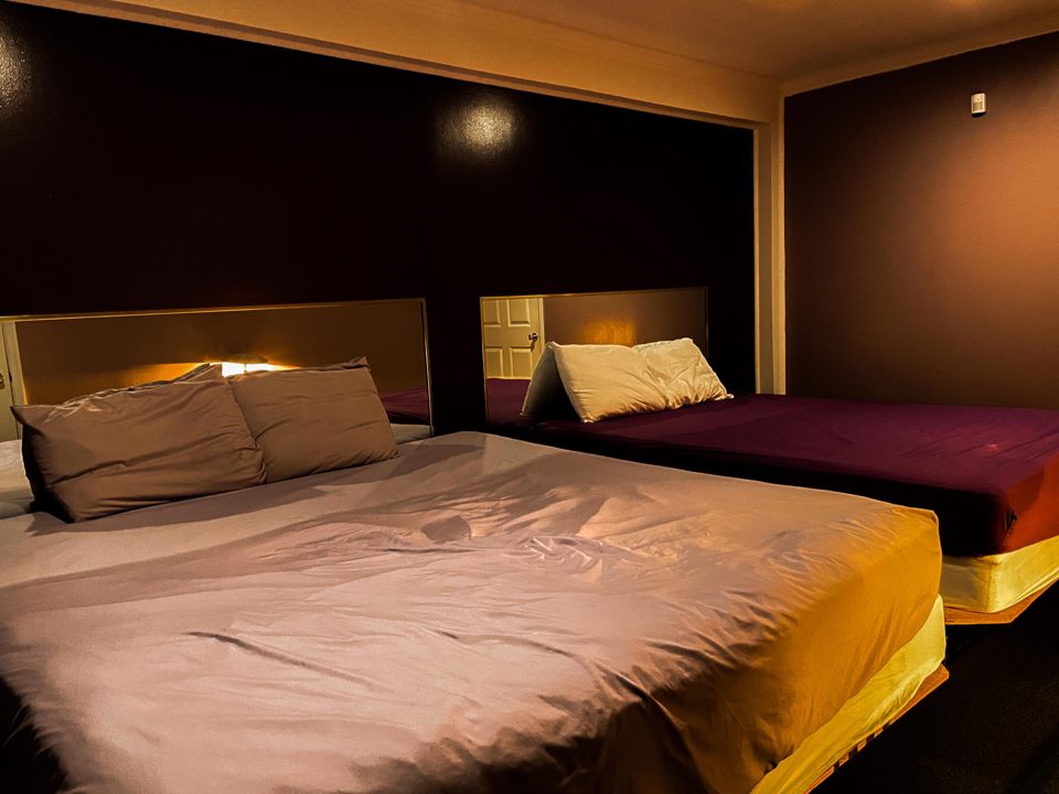 Mirrored play room with two beds