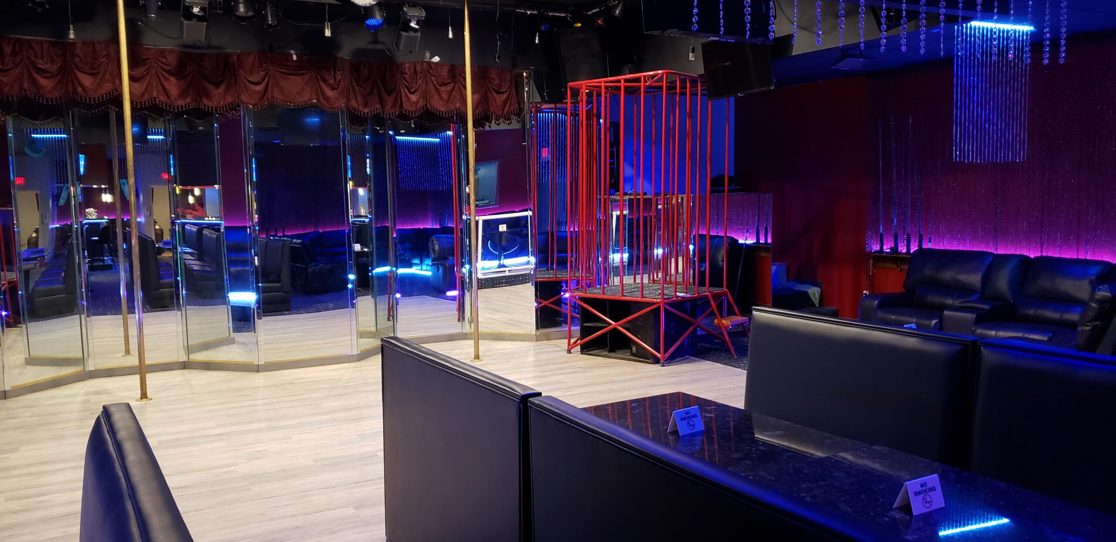 Dance floor with poles and mirrored walls